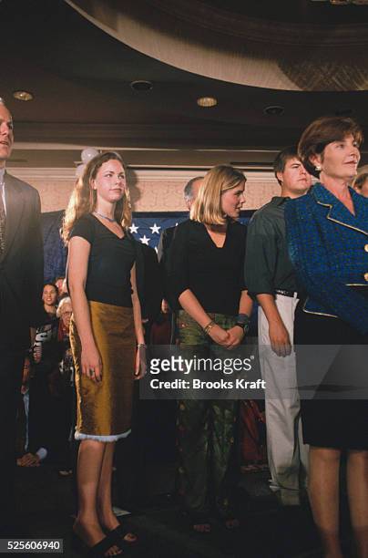 Laura Bush with daughters Jenna and Laura nearby, during a campaign event for George W. Bush.