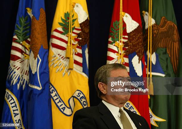 Attorney General John Ashcroft listens to President George W. Bush announce his support for bipartisan legislation for victims of violent crime at...