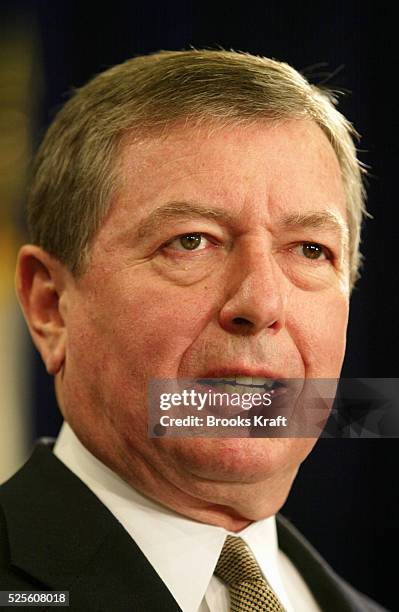 Attorney General John Ashcroft listens to President George W. Bush announce his support for bipartisan legislation for victims of violent crime at...