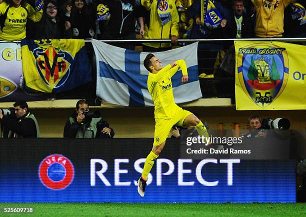 Denis Suarez of Villarreal celebrates as Adrian Lopez of Villarreal scores thie first goal during the UEFA Europa League semi final first leg match...