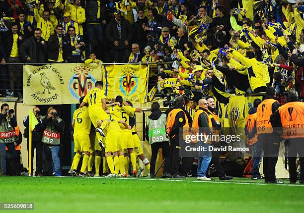 Villarreal players celebrate with fans as Adrian Lopez of Villarreal scores thie first goal during the UEFA Europa League semi final first leg match...