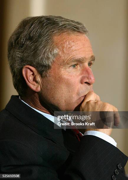 President George W. Bush listens as Nancy Reagan receives the Congressional Gold Medal for herself and her husband, former President Ronald Reagan on...