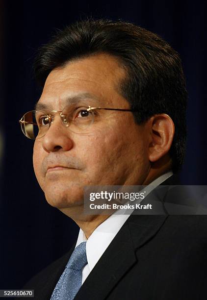 Alberto R. Gonzales, White House Chief Counsel, listens to President Bush speak.