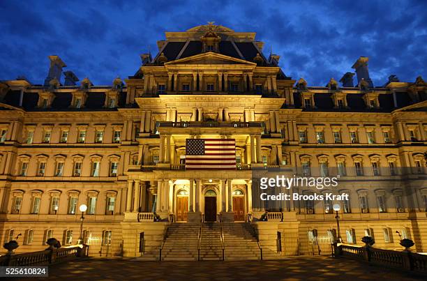 The Dwight D. Eisenhower Executive Office Building, also known simply as the Old Executive Office Building, is illuminated as evening falls in...