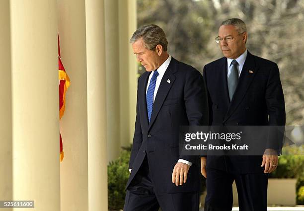 President George W. Bush makes a statement on the Middle East with Secretary of State Colin Powell in the Rose Garden at The White House. After this...