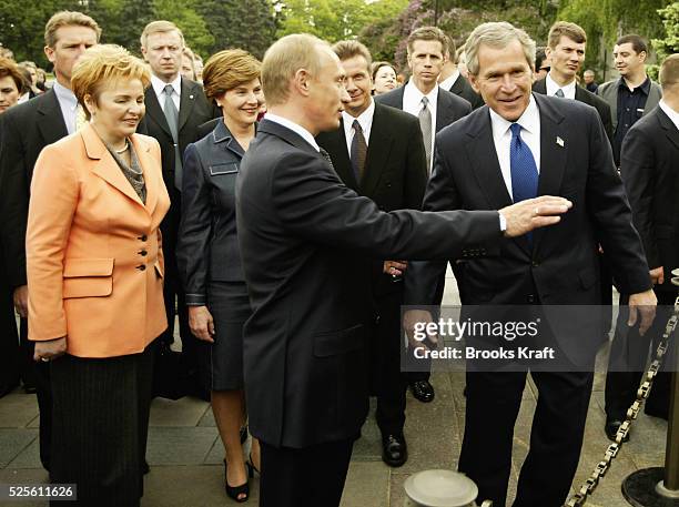President George W. Bush and Russian President Vladimir Putin walk through Cathderal Square after holding a nuclear arms discussion at the Kremlin....