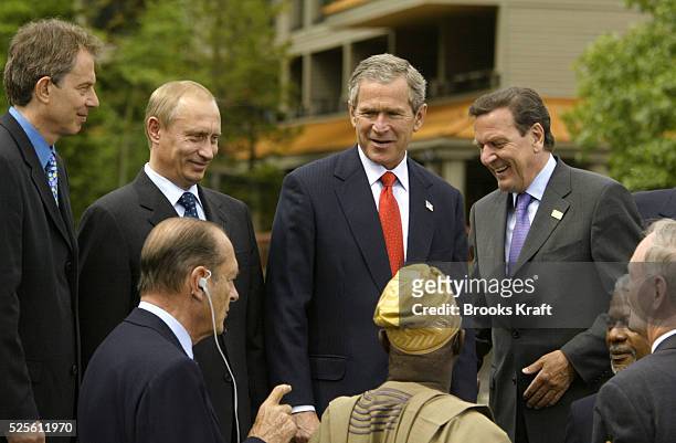 Members of the 2002 G8 economic summit chat with leaders of African nations at the meeting's conclusion in Alberta, Canada. : England's prime...