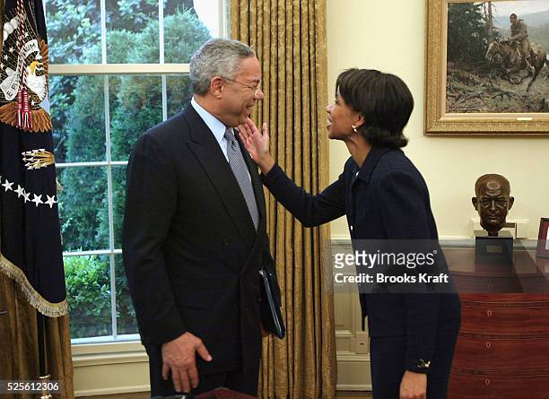Secretary of State Colin Powell and National Security Advisor Condoleezza Rice talk after a meeting with President George Bush and Islom Karimov,...