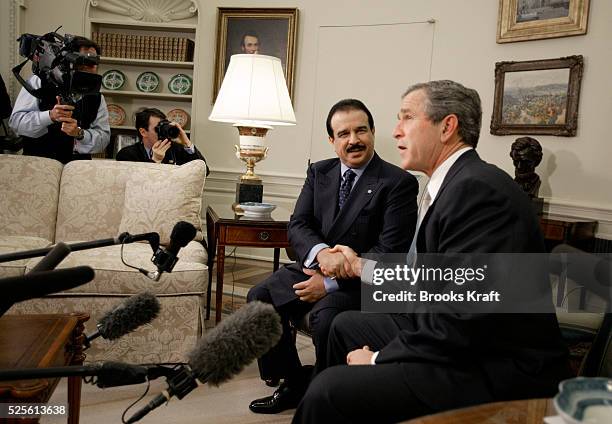 President George W. Bush shakes hands with Bahrain's King Hamad bin Isa al Khalifa in the Oval Office of the White House. The Persian Gulf Arab state...