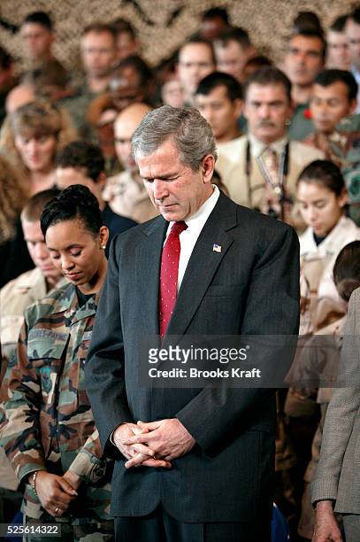 President George W. Bush participates in a short prayer before speaking to the military community at McDill Air Force Base, home of the United States...