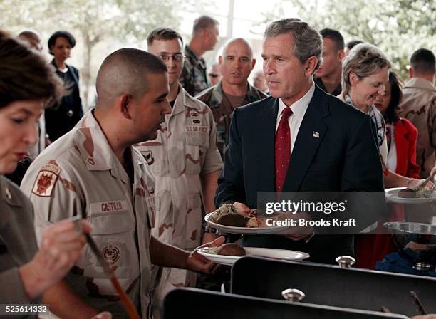 President George W. Bush has lunch with military personnel at the United States Central Command Center, located at McDill Air Force Base.