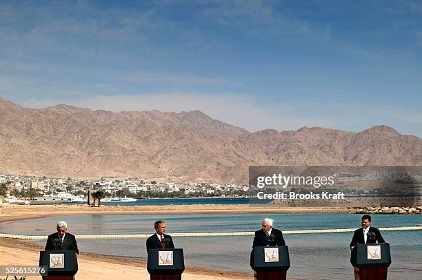 United States President George W. Bush makes statements with Palestinian Prime Minister Mahmoud Abbas and Israel Prime Minister Ariel Sharon at the...