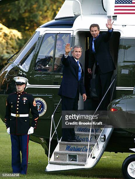 United States President George W. Bush and British Prime Minister Tony Blair get onto Marine One as they depart the White House en route to Andrews...