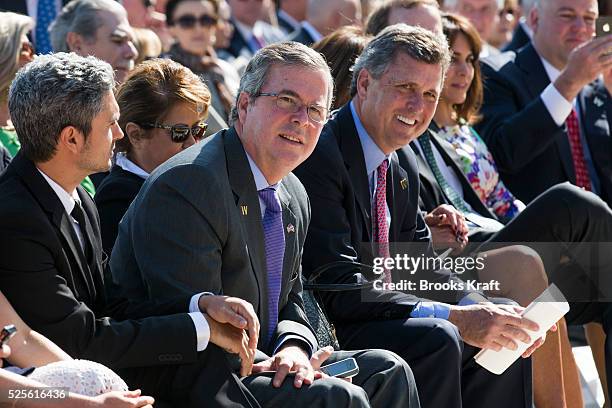 Jeb Bush, left, and Marvin Bush, brothers of George W. Bush attend the dedication of the George W. Bush presidential library on the campus of...