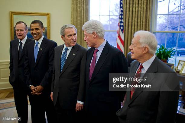 President George W. Bush meets with former President George H.W. Bush , President-elect Barack Obama , former President Bill Clinton and former...