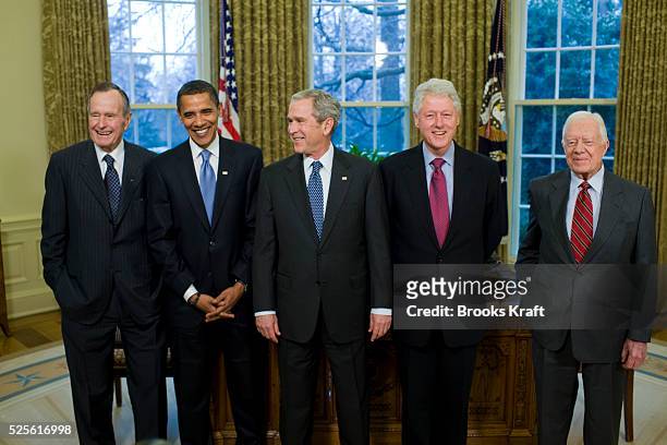 President George W. Bush meets with former President George H.W. Bush , President-elect Barack Obama , former President Bill Clinton and former...