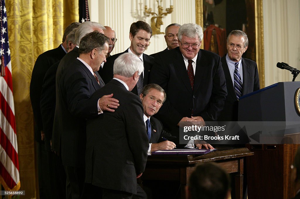 Signing Rfs W. Bush United States President George W. Bush signs the emergency... News ...