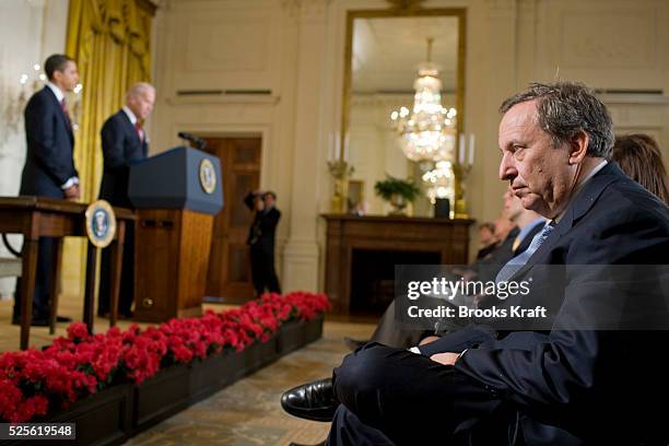 Larry Summers, an economic advisor in the Obama administration, watches as U.S. President Barack Obama and Vice President Joe Biden speak in the East...