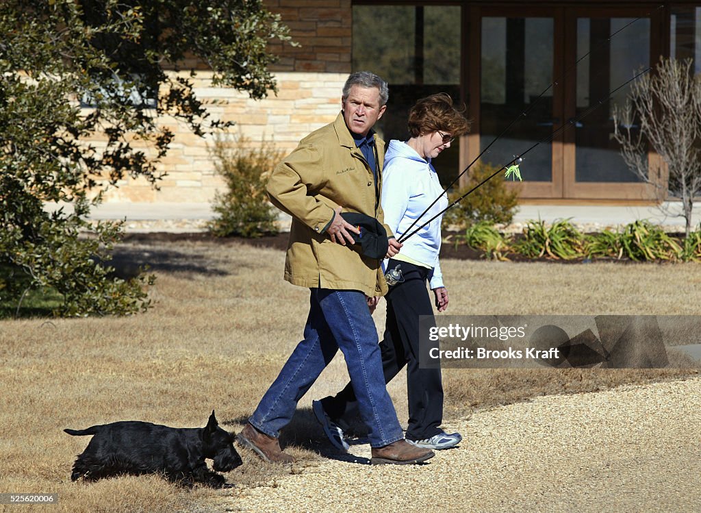W. Bush Ranch U.S. President George W. Bush heads off for a walk with his wife and ...