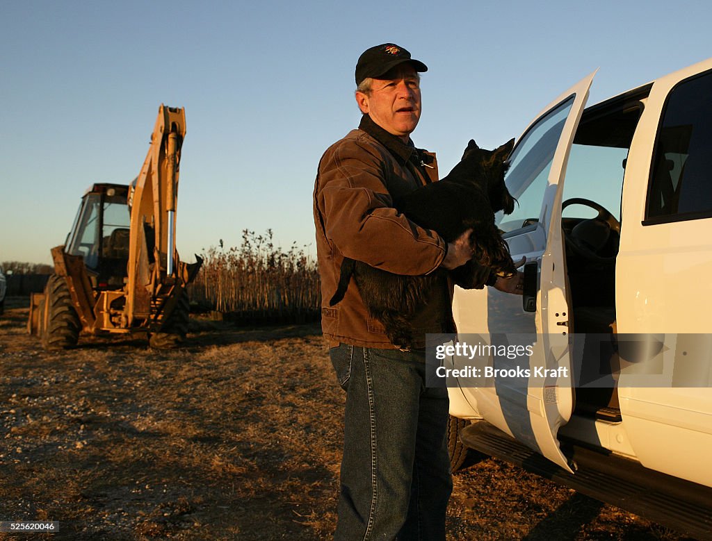 W. Bush Ranch U.S. President George W. Bush carries his dog Barney as he prepares ...