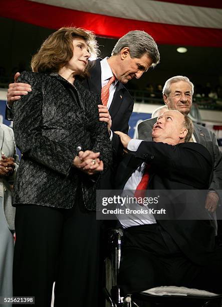 Democratic presidential hopeful Senator John Kerry of Massachusetts celebrates with his wife Teresa Heinz Kerry and former Senator Max Cleland during...