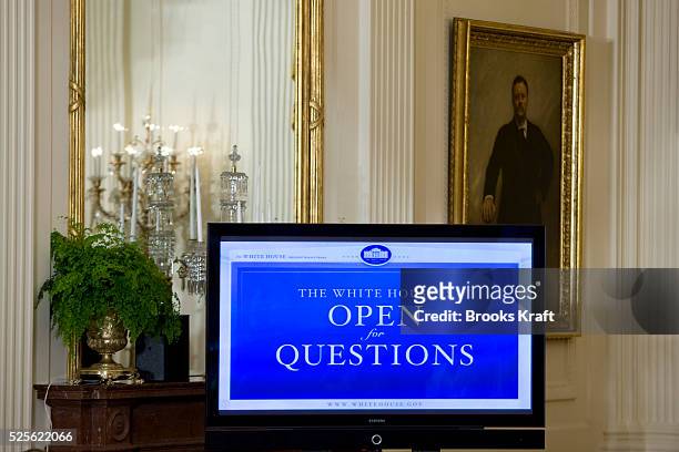 Television monitor at President Barack Obama's online virtual town hall meeting in the East Room at the White House.