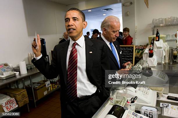 President Barack Obama and Vice President Joe Biden place their lunch orders at Ray's Hell Burger in Arlington, Virginia.