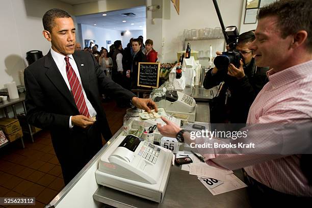 President Barack Obama and Vice President Joe Biden place their lunch orders at Ray's Hell Burger in Arlington, Virginia.