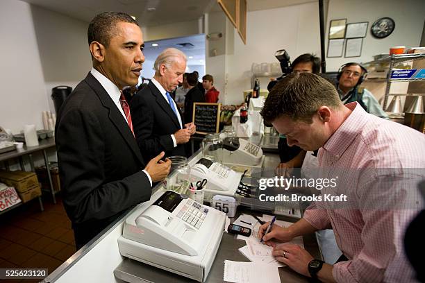 President Barack Obama and Vice President Joe Biden place their lunch orders at Ray's Hell Burger in Arlington, Virginia.