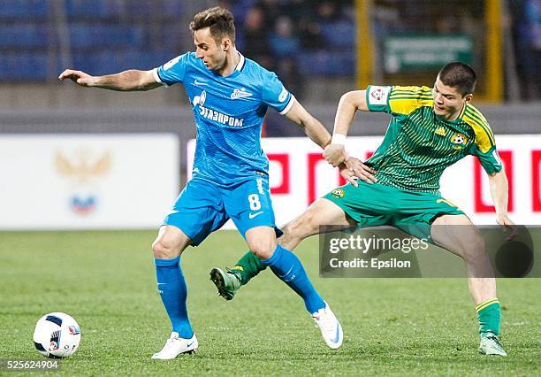 Mauricio of FC Zenit St. Petersburg and Arsen Khubulov of FC Kuban Krasnodar vie for the ball during the Russian Football League match between FC...