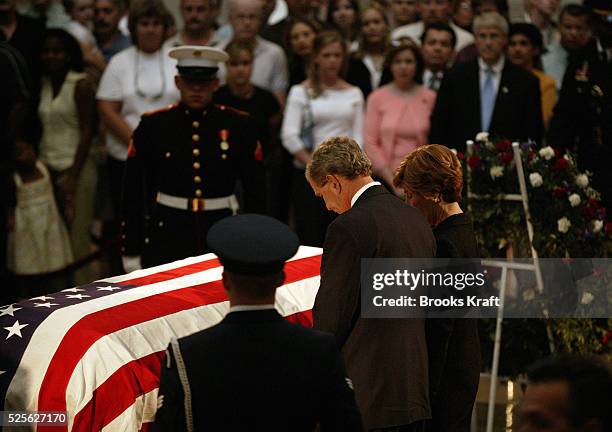 President Bush and first lady Laura Bush pay their final respects to former President Ronald Reagan at the U.S. Capitol in Washington. The body was...