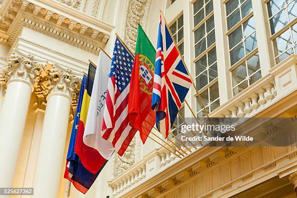 Brussels 30 july 2012 Several international flags hanging on the ceiling photographed in the hall of the former 19th century stock exchange of...