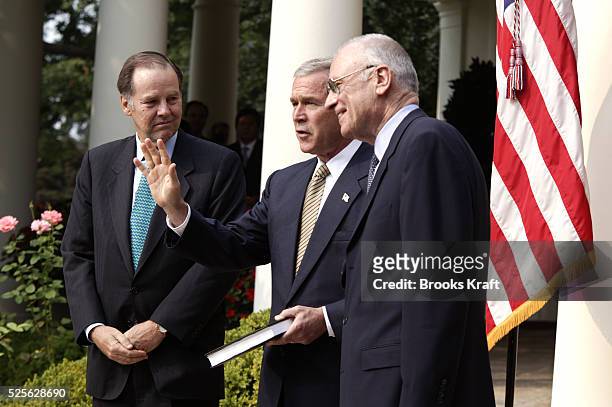 President George W Bush speaks about the release of the September 11th Commission's final report, in the Rose Garden at the White House, in...