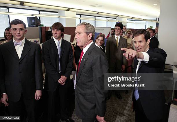 President George W. Bush visits his campaign headquarters in Arlington, July 21, 2004. On the right is Bush Cheney 2004 Campaign Manager Ken Mehlman.