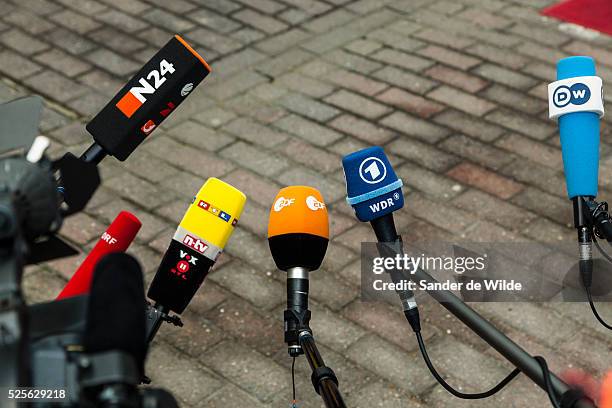 German microphones of the German press N24, rtl, zdf, wdr and dw wait for arrivals at an EU summit in Brussels on Friday, Oct. 19, 2012. European...