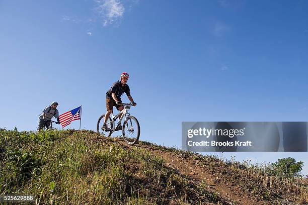 Former President George W Bush leads riders during the W100K ride for wounded military veterans on his Texas ranch.