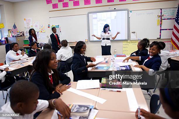 Mrs. Robinson and her 6th grade Language Arts class await former Massachusetts Gov. Mitt Romney, a candidate for the Republican presidential...