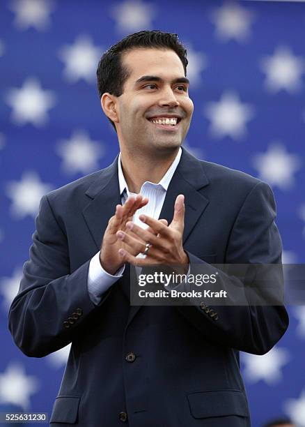 George P. Bush applauds his uncle U.S. President George W. Bush at a campaign rally in Hobbs, New Mexico, October 11, 2004.