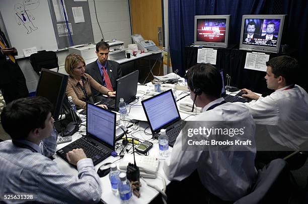 Senior staff members of the Bush Cheney campaign gather in the rapid response room for the Vice Presidential debate in Cleveland, Ohio, October 5,...