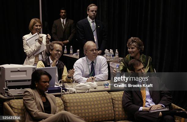 White House senior staff members and Bush campaign leadership watch the first debate backstage at the University of Miami in Coral Gables, Florida,...