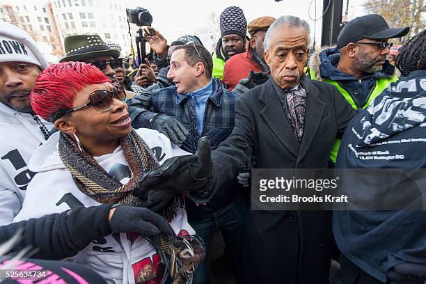 Rev. Al Sharpton clears a path for Lesley McSpadden , mother of Ferguson shooting victim Michael Brown, at the 'Justice for All' march and rally in...