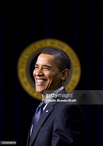 American politician US President Barack Obama smiles as he speaks at the Eisenhower Executive Office Building on the White House complex, Washington...