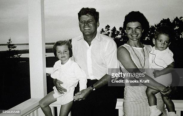 John and Jackie Kennedy and their two children, Caroline and John Jr.
