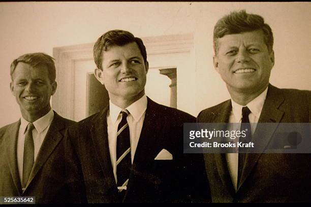 President Kennedy and his brothers, Attorney General Robert F. Kennedy and Senator Edward M. Kennedy. White House, outside Oval Office.