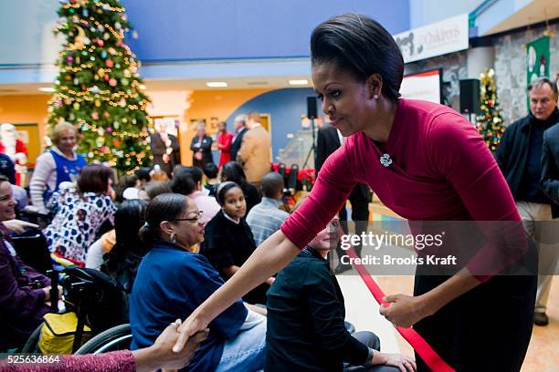 First Lady Michelle Obama greets patients and families while visiting Children's Hospital in Washington.