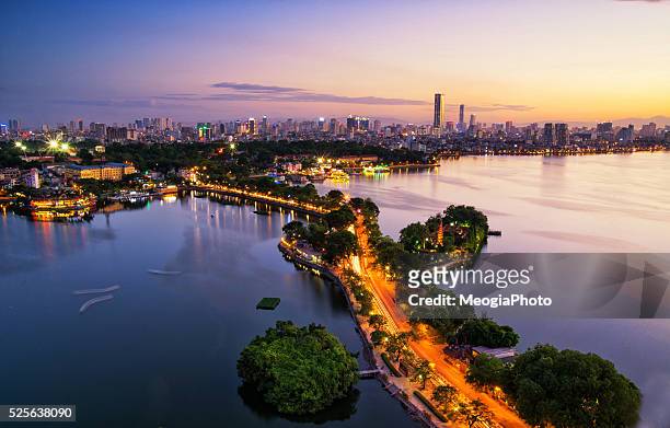 aerial view of hanoi skyline cityscape at sunset time - vietnam war photos stock-fotos und bilder