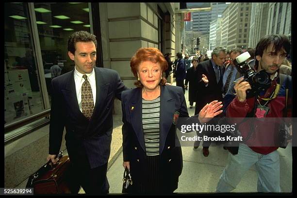 REGINE AND HER SON, LIONEL ROTCAGE, IN COURT