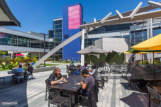 Google employees enjoy outdoor lunch at Charlie's Cafe at Google Headquarters in Mountain View, California. The Googleplex campus includes over 20...