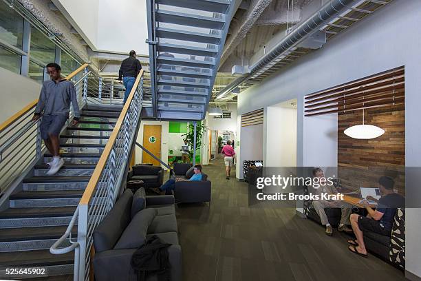 Google employees at work inside an office building at the Googleplex corporate headquarters complex of Google, Inc., located in Mountain View,...