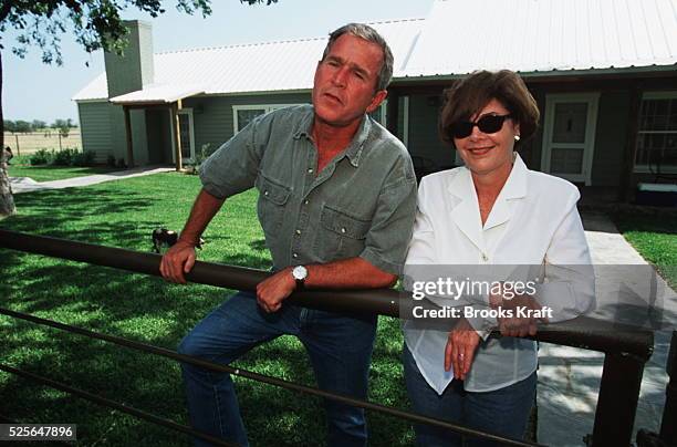 Republican Candidate for President George W.Bush and his wife Laura, answer questions from the press on their ranch in Crawford, Texas.